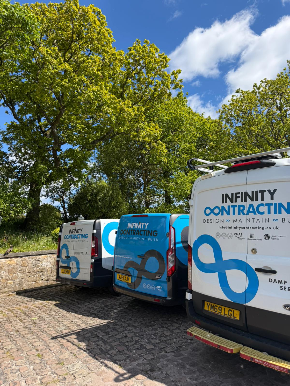 Infinity Contracting vans on site